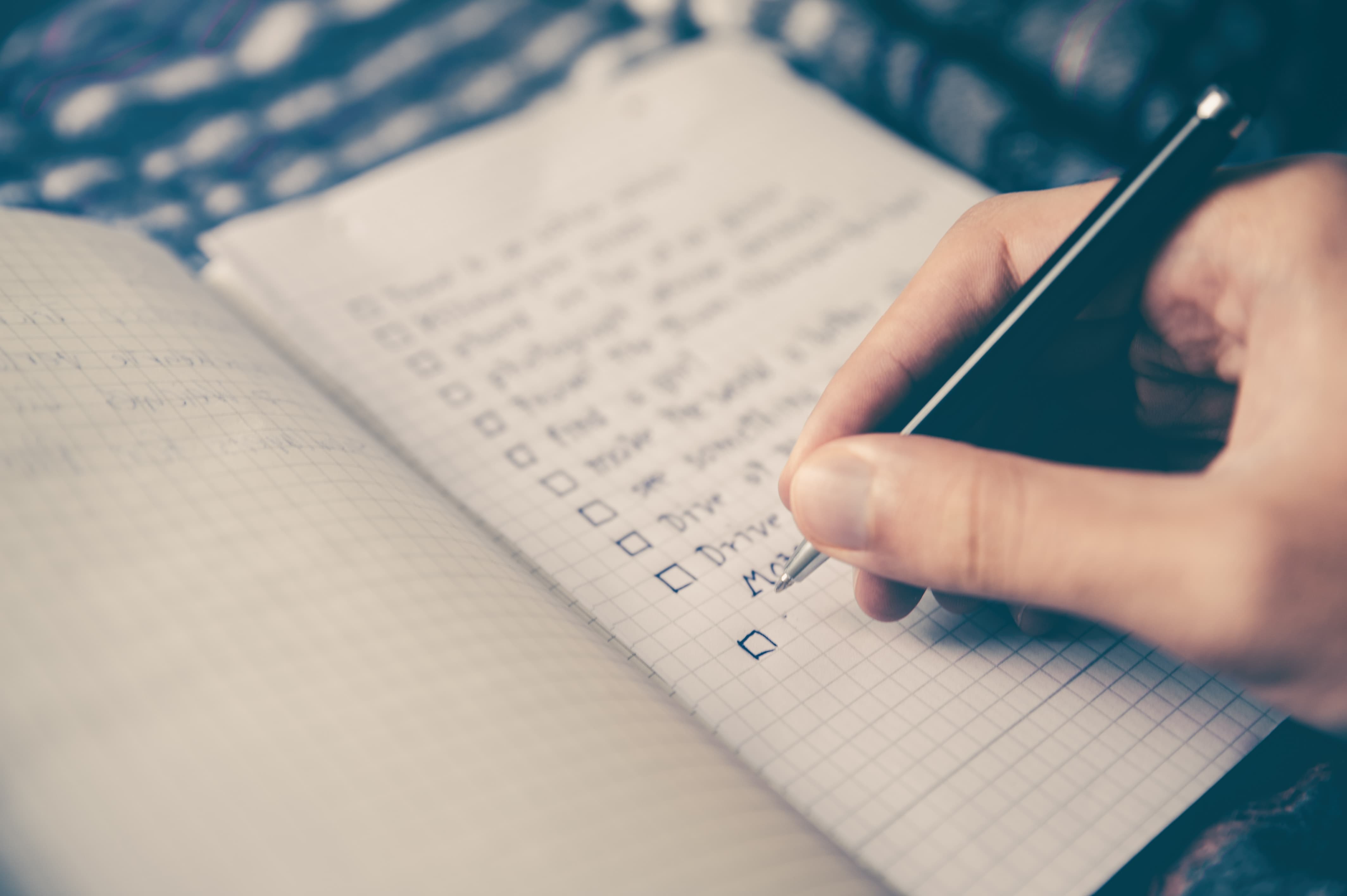 Hand writing on a checklist
